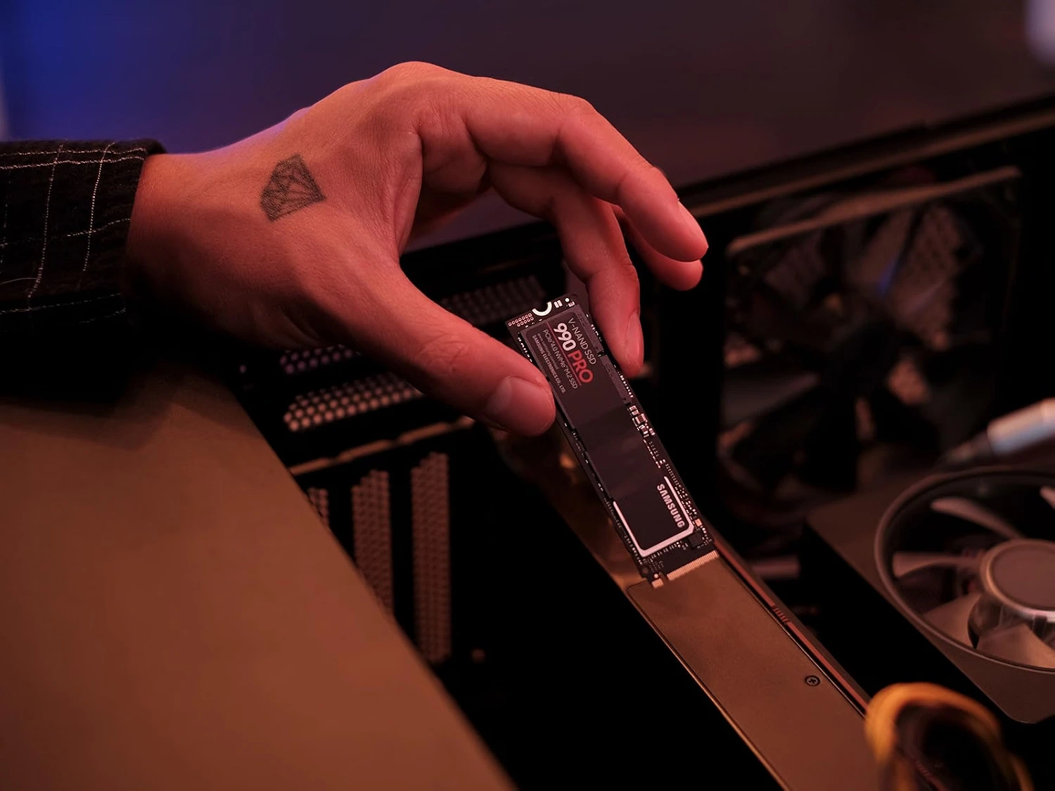 Samsung 990 PRO 2TB NVMe SSD being installed in a PC