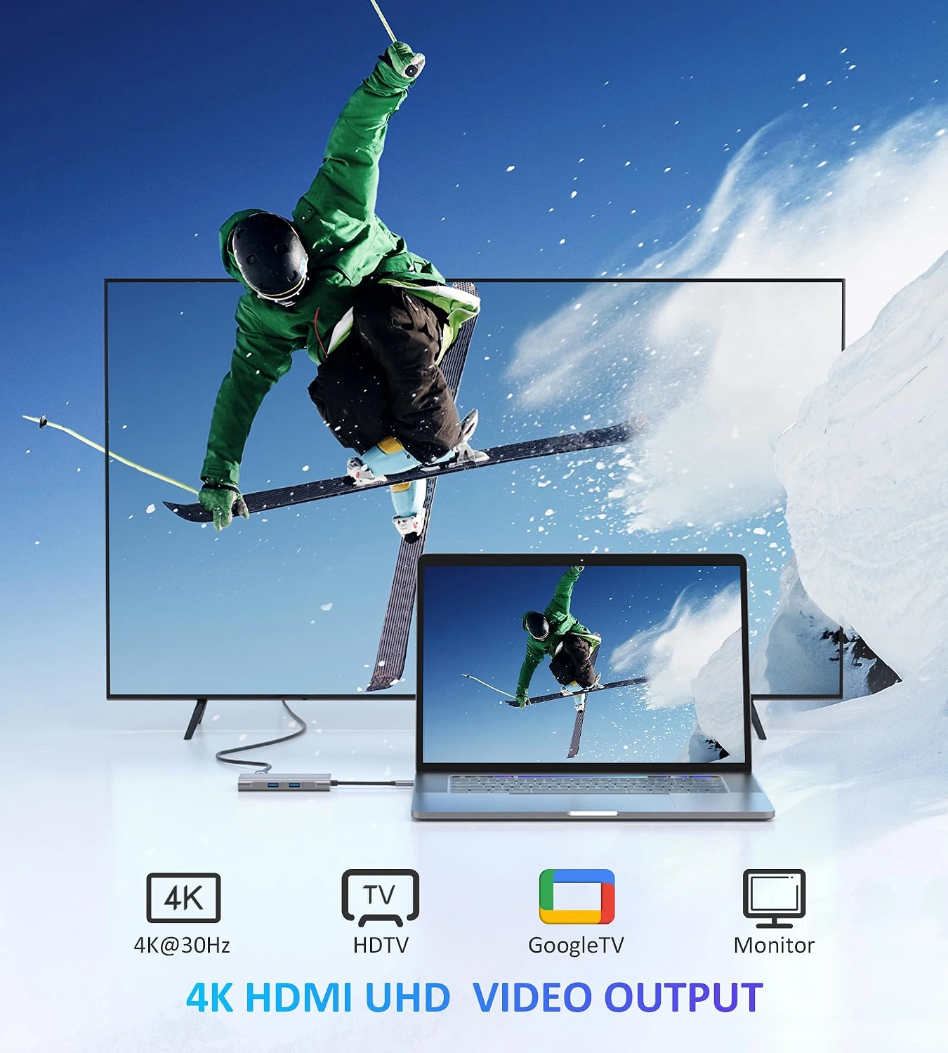 Laptop connected to a TV displaying 4K HDMI video output of a skier.